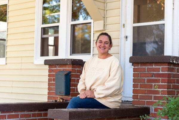 Kate outside her home